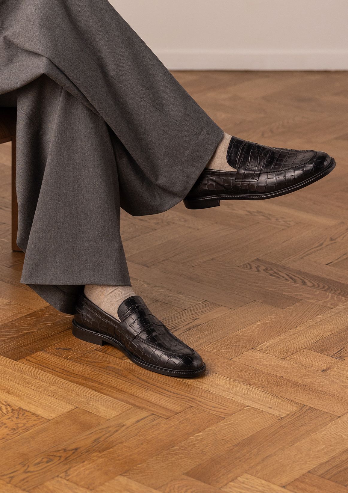 Schwarze Leder-Loafer mit Krokomuster