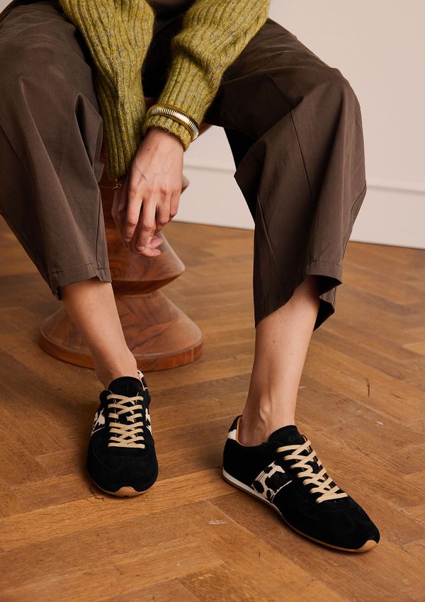 Zwarte suède sneakers met cow print detail