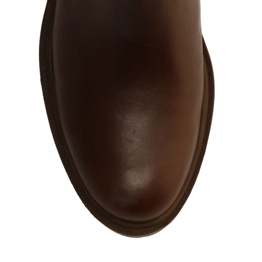 Bruine leren hoge laarzen